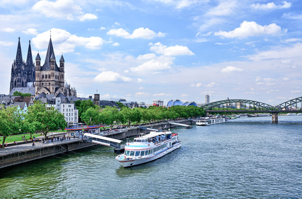 Promenade and Rhine River in Cologne, Germany. Composite photo