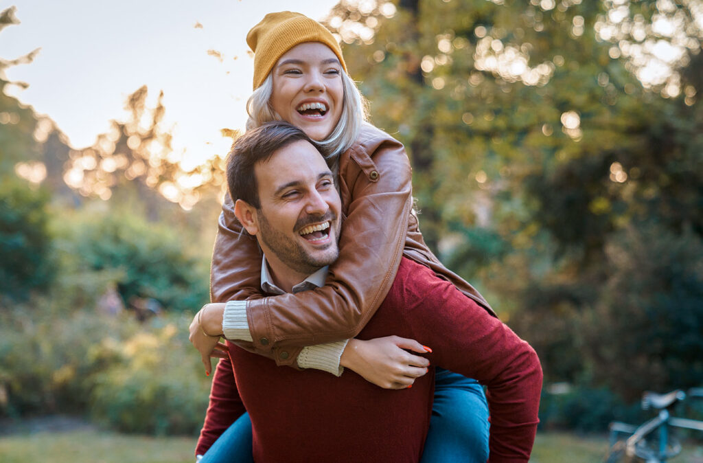 Young couple on romantic date having fun together outdoors - Stock Image