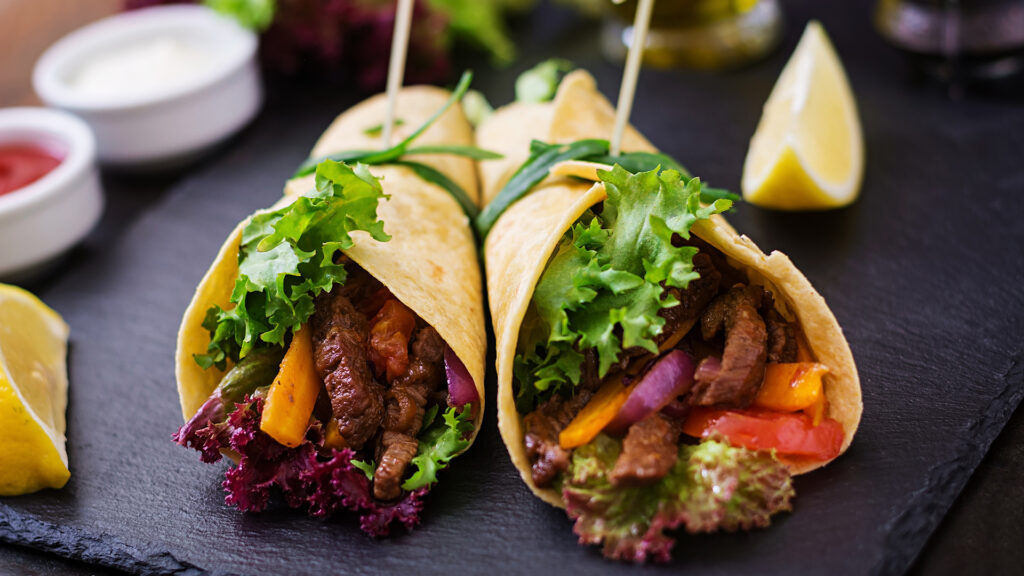 Mexican fajitas for beef and grilled vegetables (paprika, red onion, tomato).