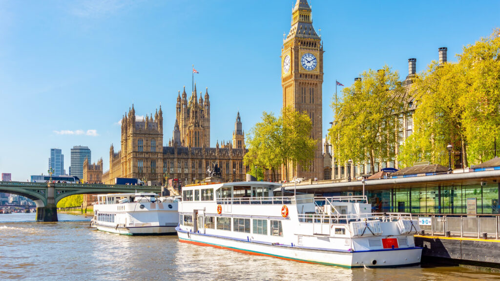 Westminster pier and Houses of Parliament with Big Ben, London, UK