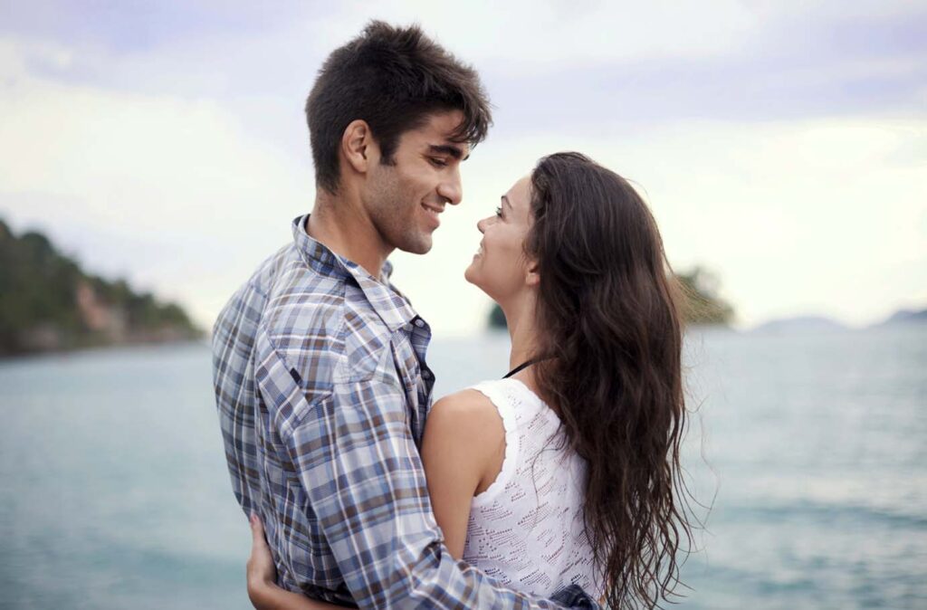 Shot of an affectionate young couple enjoying a vacation by the sea