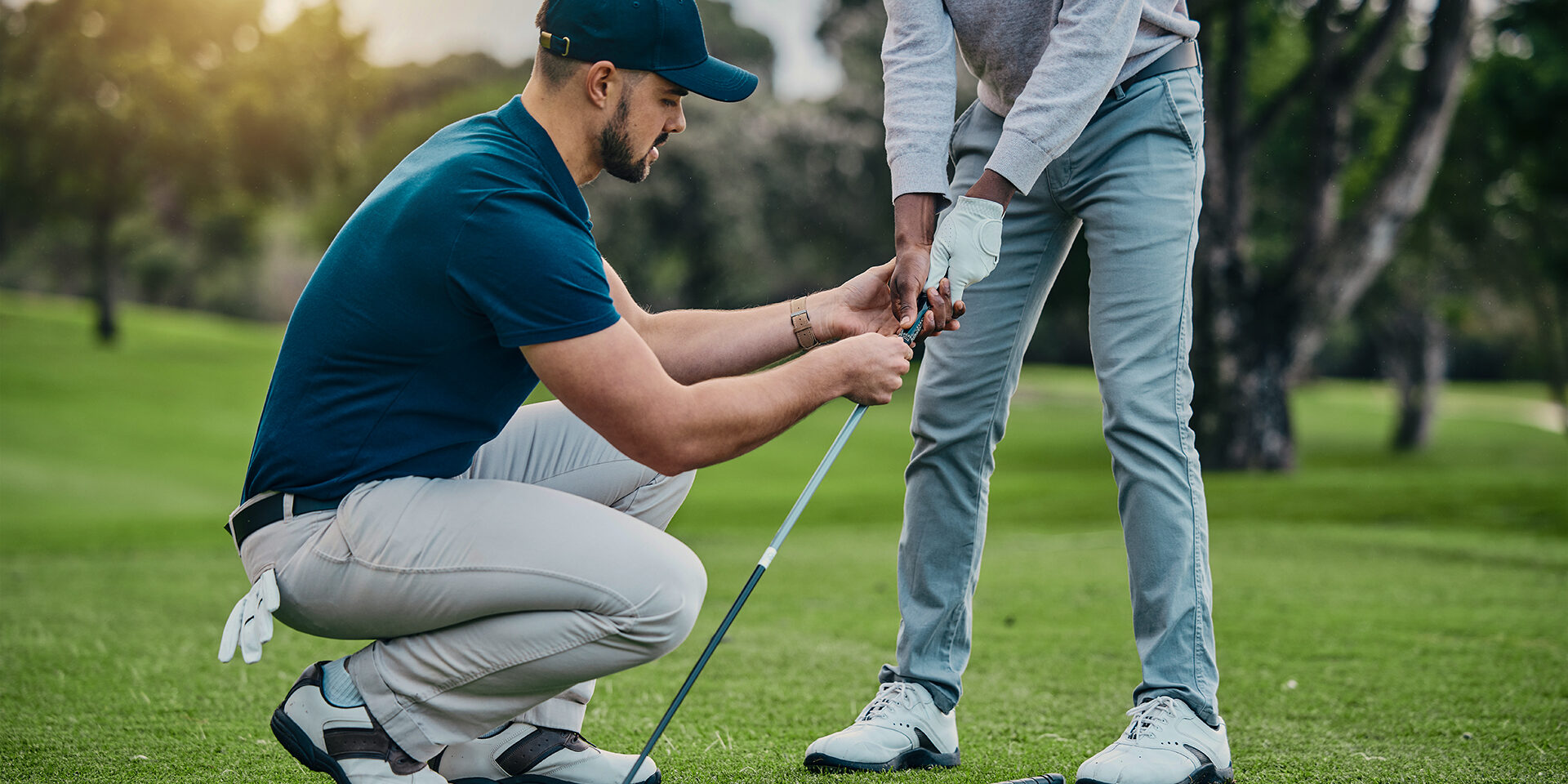 Golf lesson, teaching and sports coach help man with swing, putt and stroke outdoor. Lens flare, green course and club support of a athlete ready for exercise, fitness and training for a game
