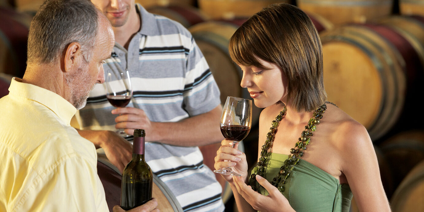 Woman Smelling a Glass of Wine