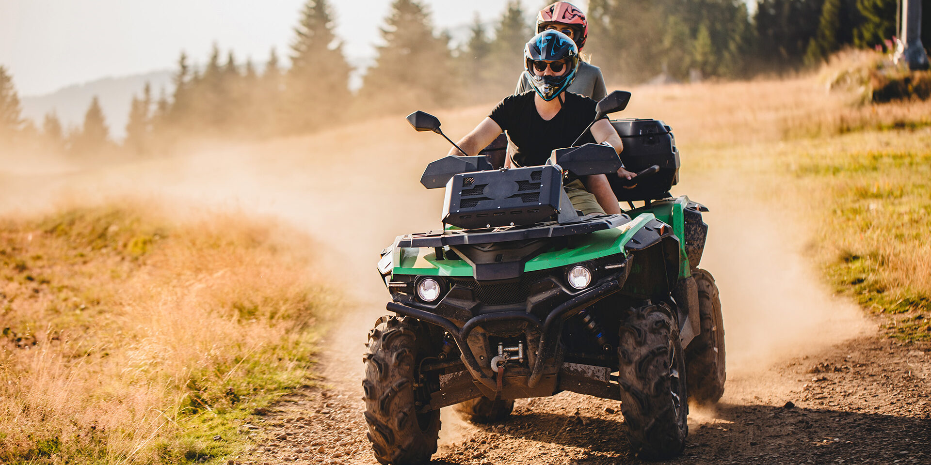 Quad bike fun Extreme sports couple riding on a quad bike together