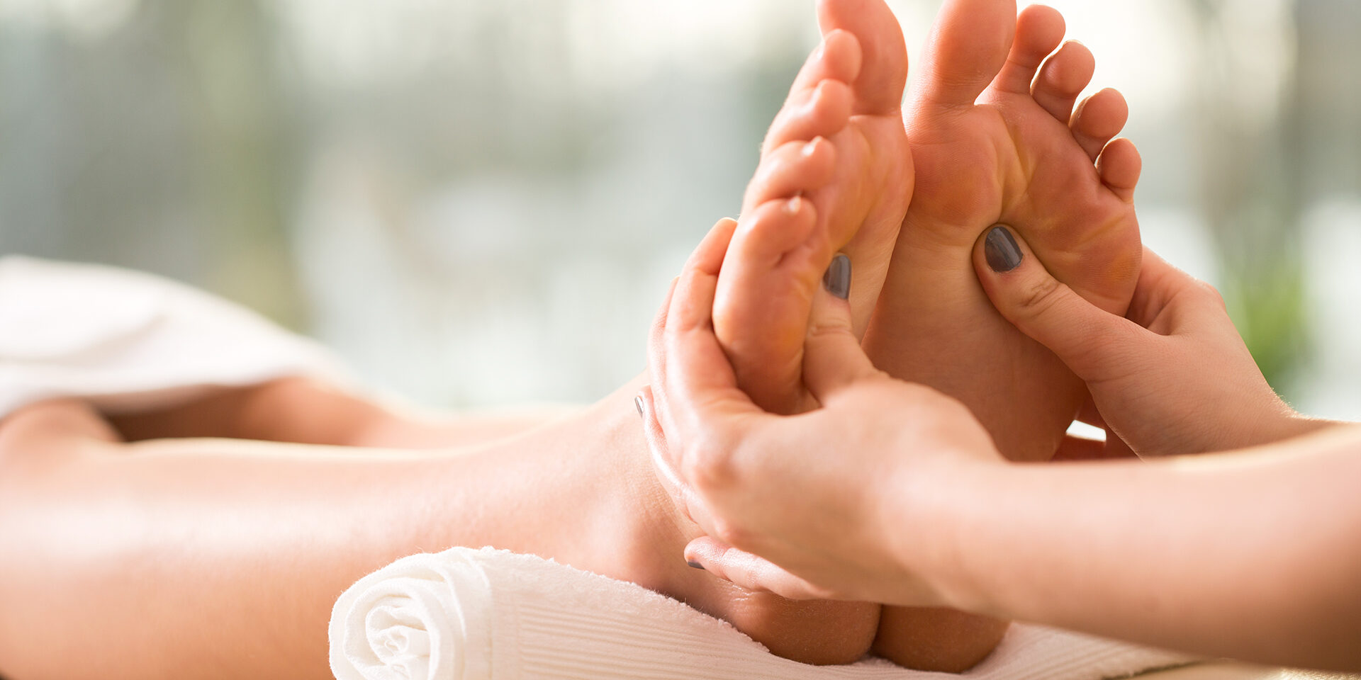 Close-up of reflexology Close-up of young woman having reflexology