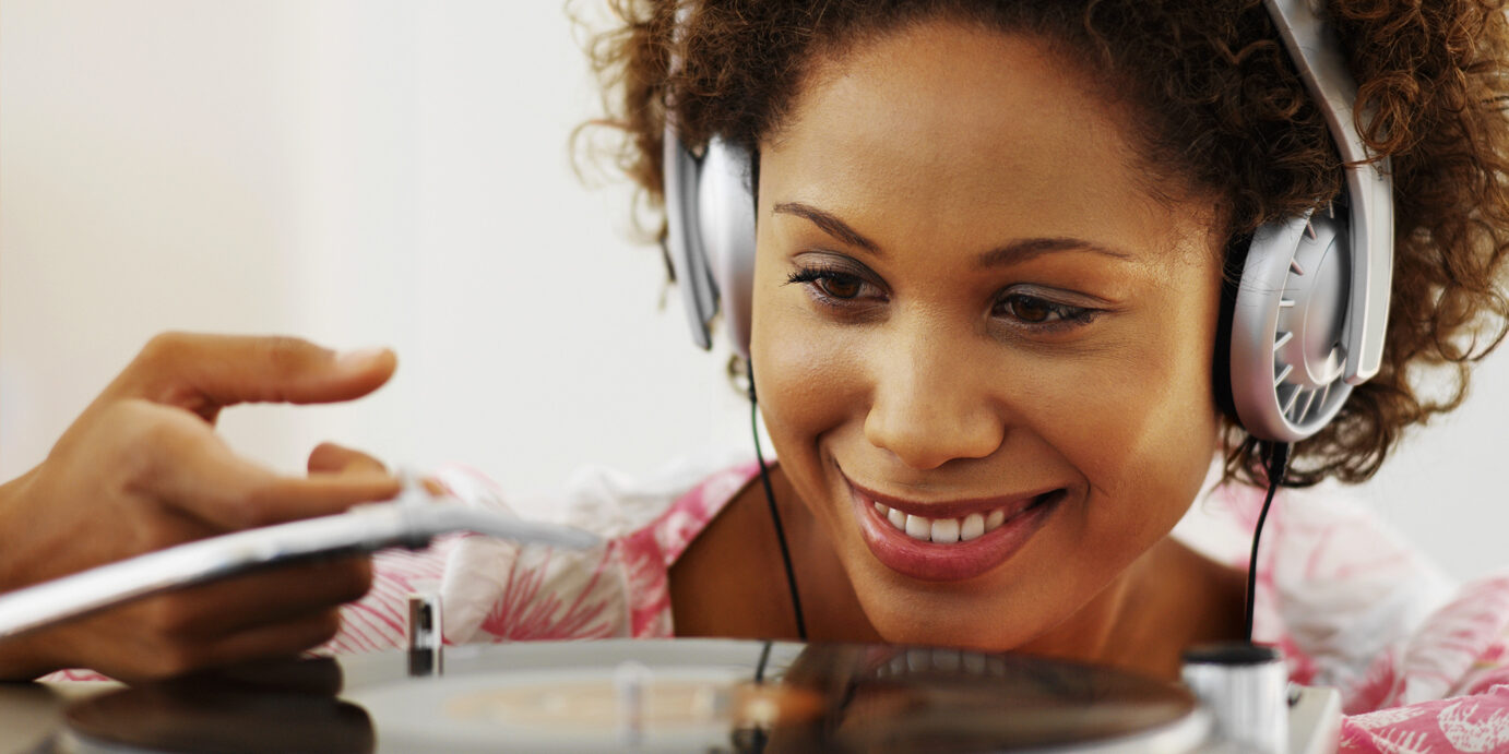 young woman playing a record