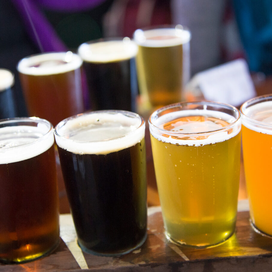 Two flights of visually cold craft beer on a tray