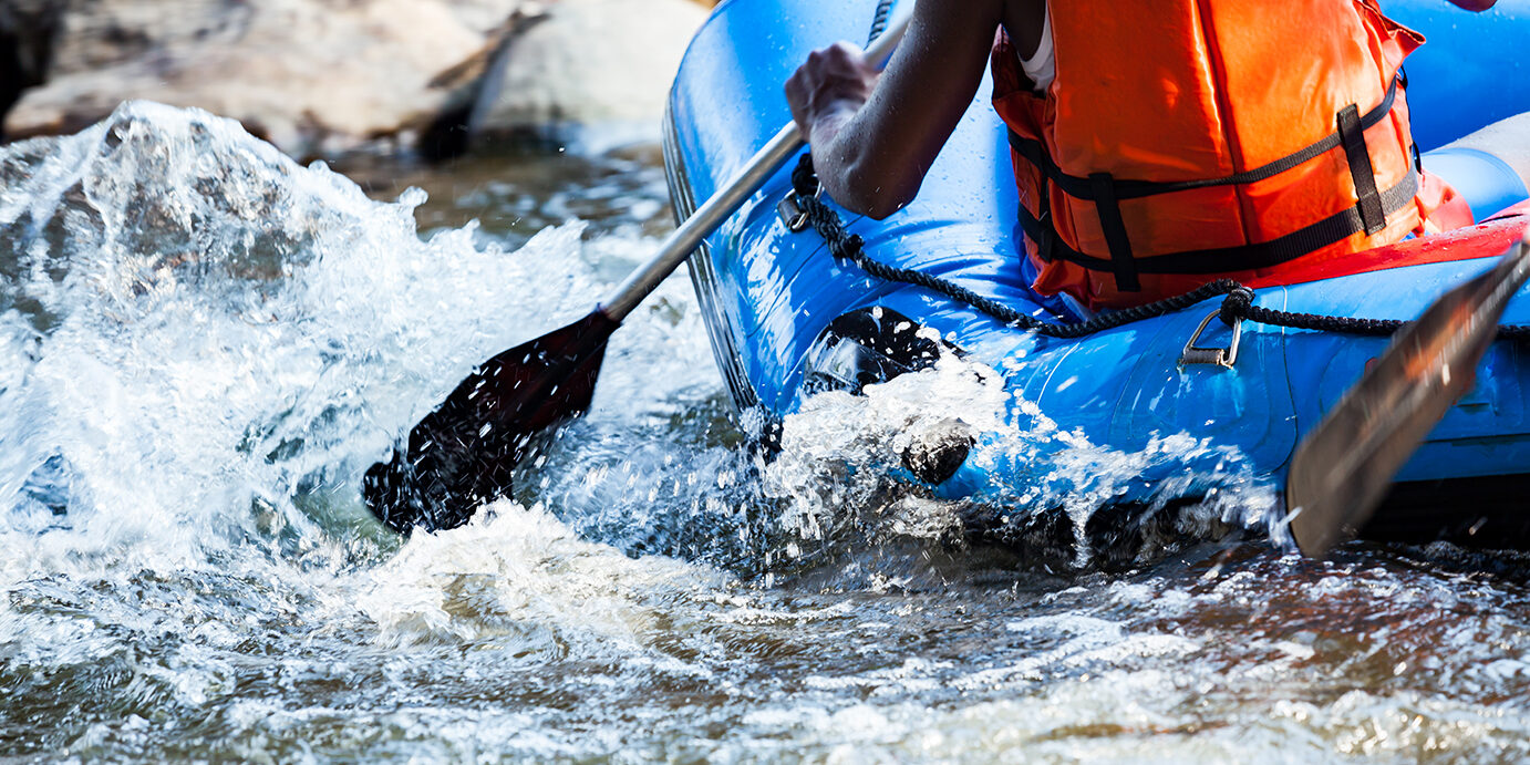 Young person rafting on the river, extreme and fun sport at tourist attraction Candid shot real time in light nature