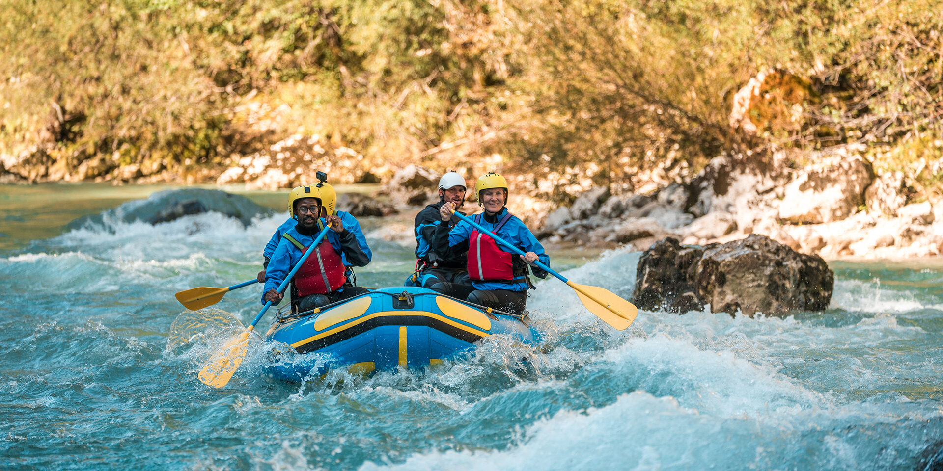 Mature Friends River Rafting with Expert Guide A group of mature friends, including Caucasian and Black individuals, with a guide, expertly rafting down a challenging river course, showing teamwork and adventure.