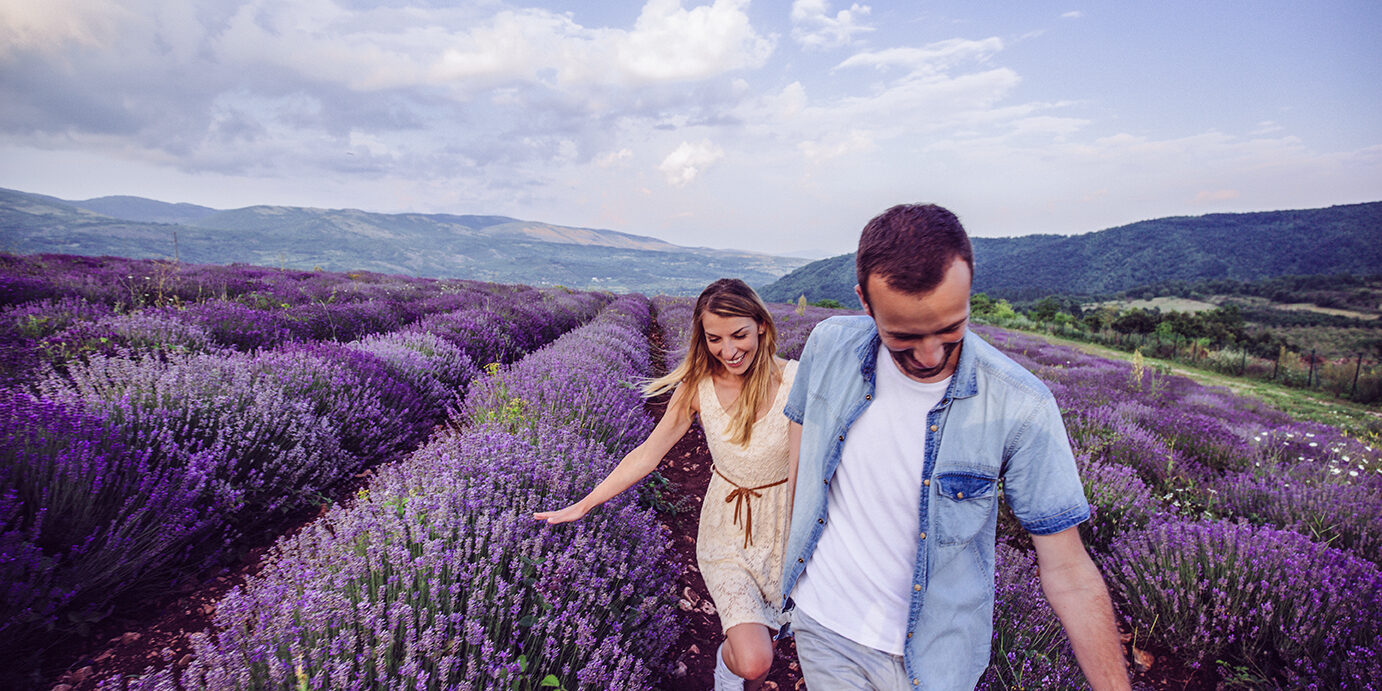 Photo of happy couple enjoying in their love at the lavender field