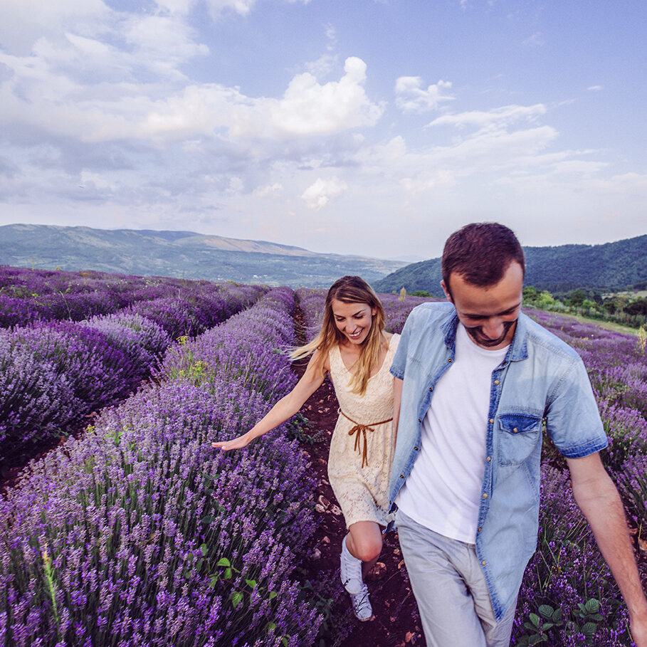 Photo of happy couple enjoying in their love at the lavender field