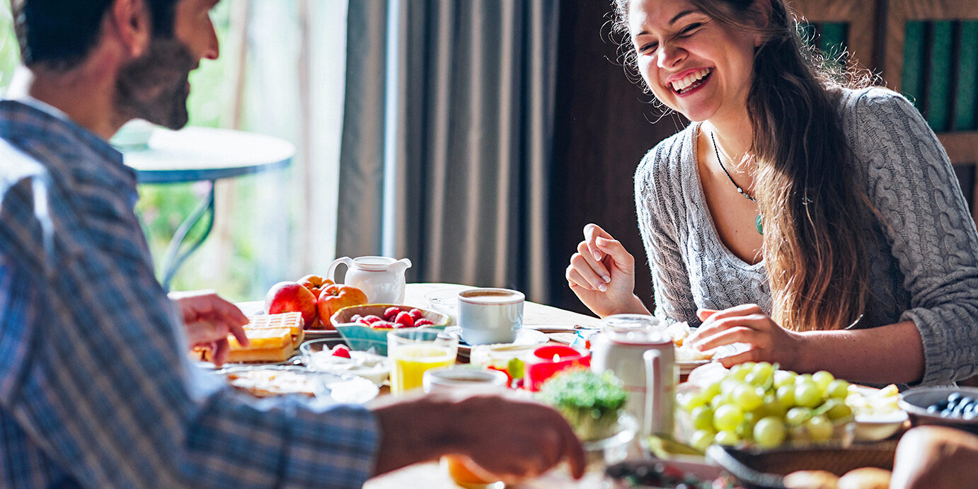 Happy couple enjoying breakfast Happy couple enjoying breakfast