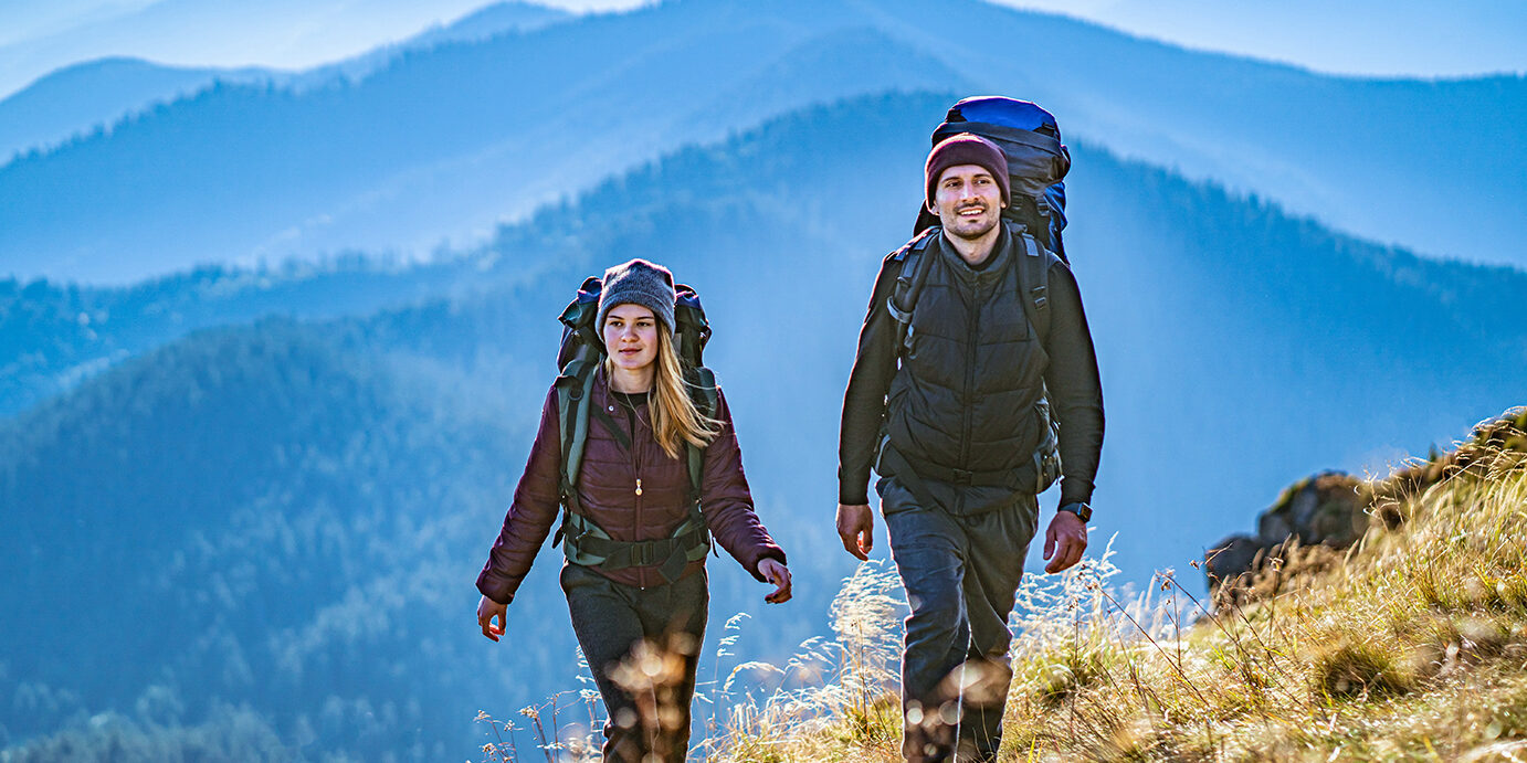 The young couple going to the mountain