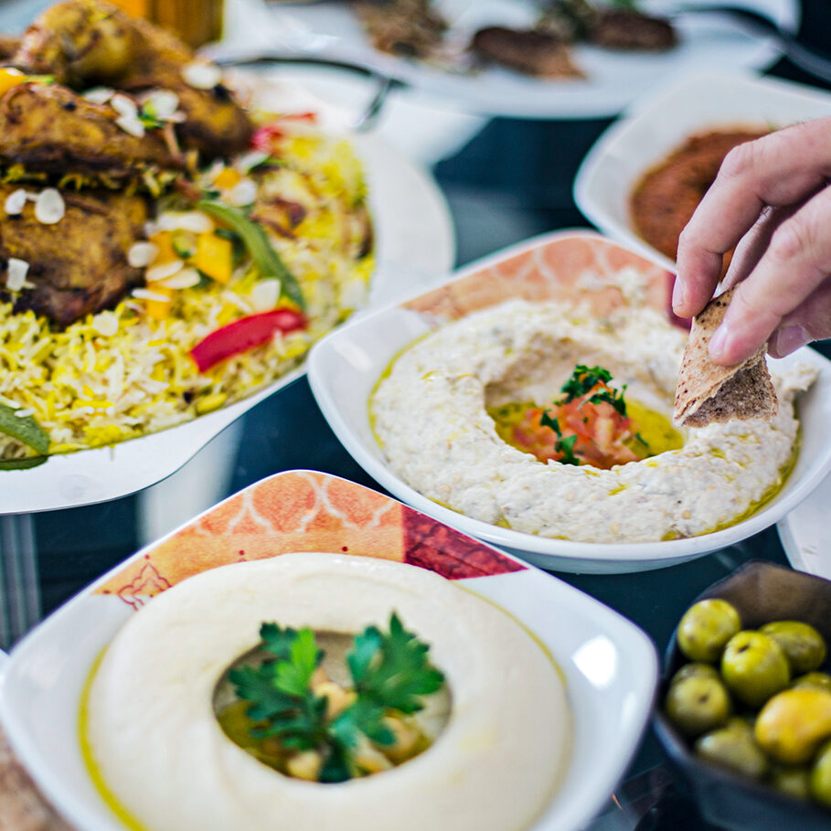 Dinning table filled with different mezze.