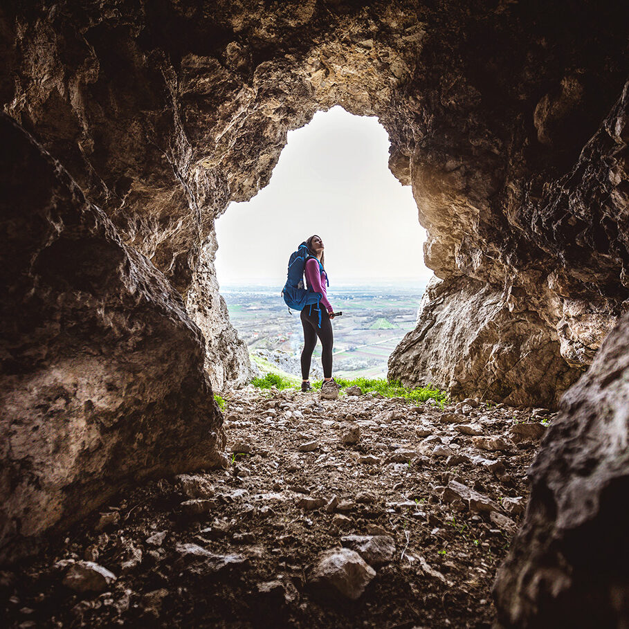 Young and adventurous girl hiking the mountains alone, living the healthy lifestyle.