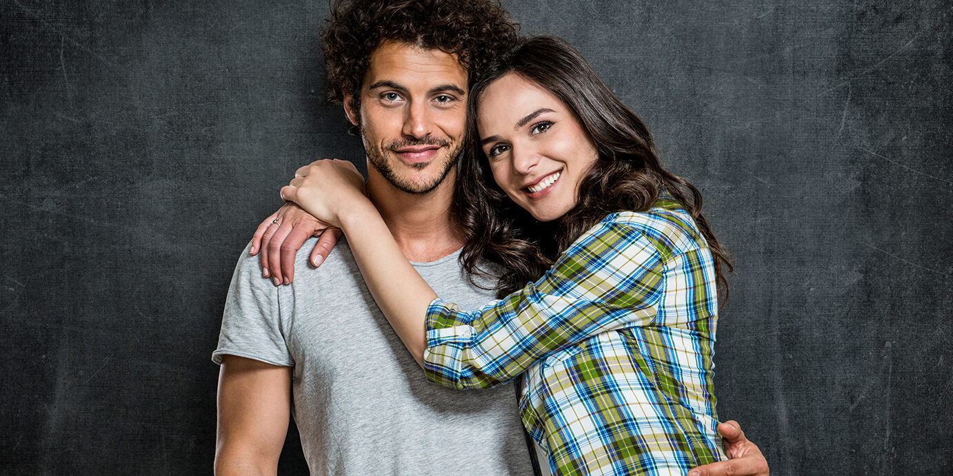 Portrait Of Young Couple Portrait Of Beautiful Young Couple Over Blackboard