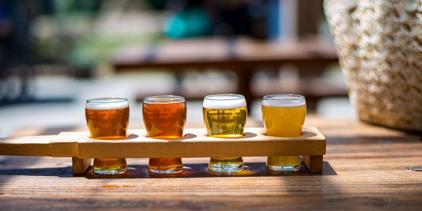 Beer flight of craft beers at outdoor beer tasting event in Canada Beer tasting in Canada