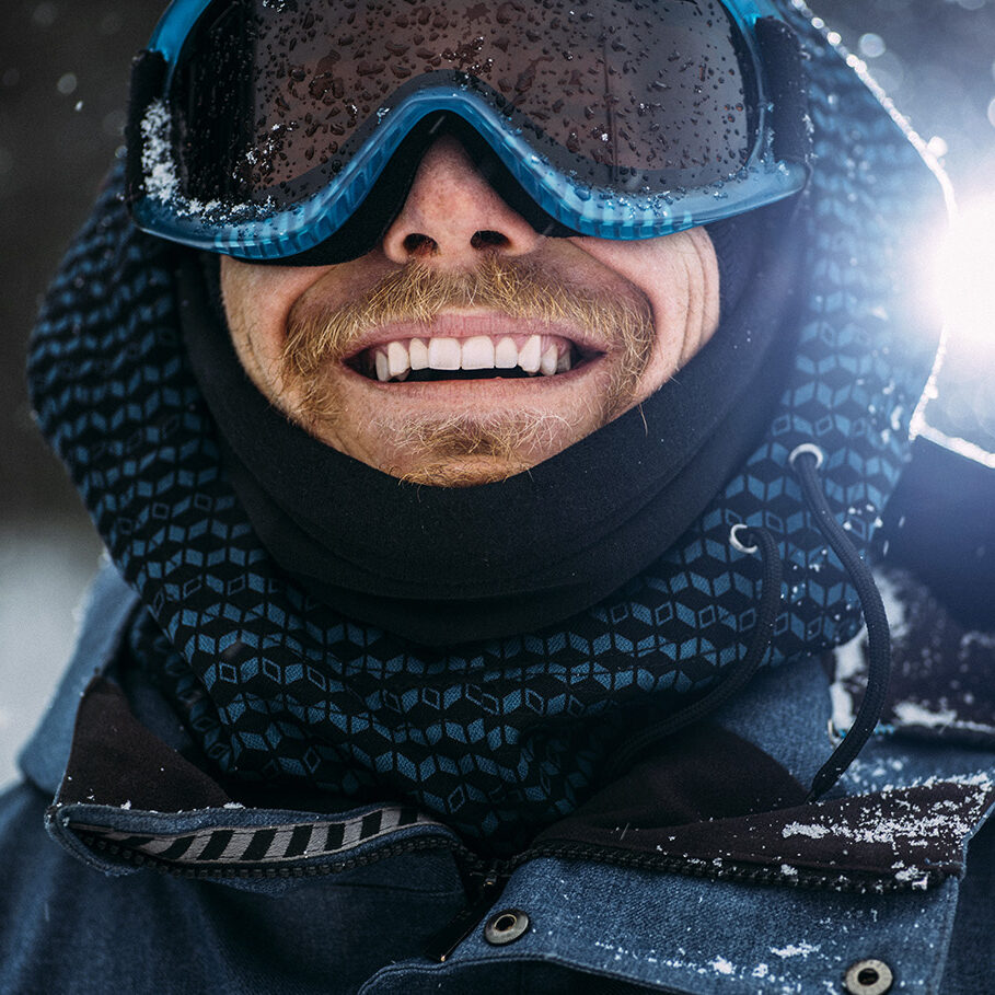 Young snowboarder smiling and posing for the camera