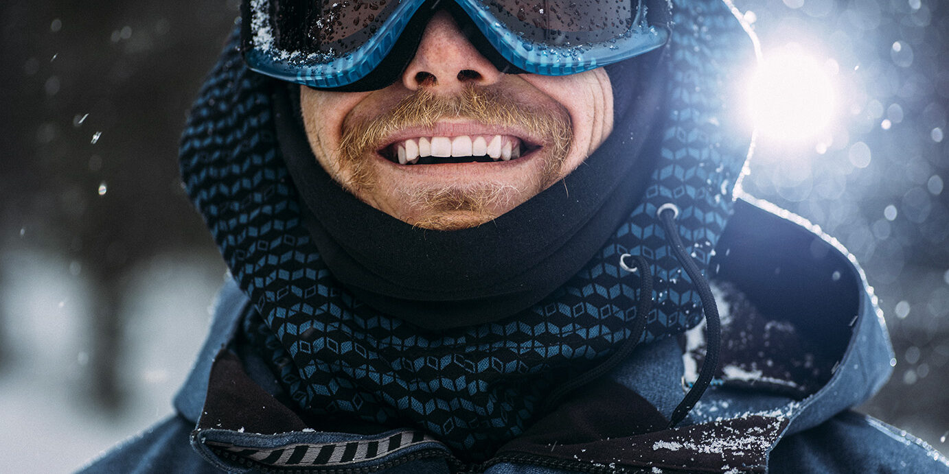 Young snowboarder smiling and posing for the camera