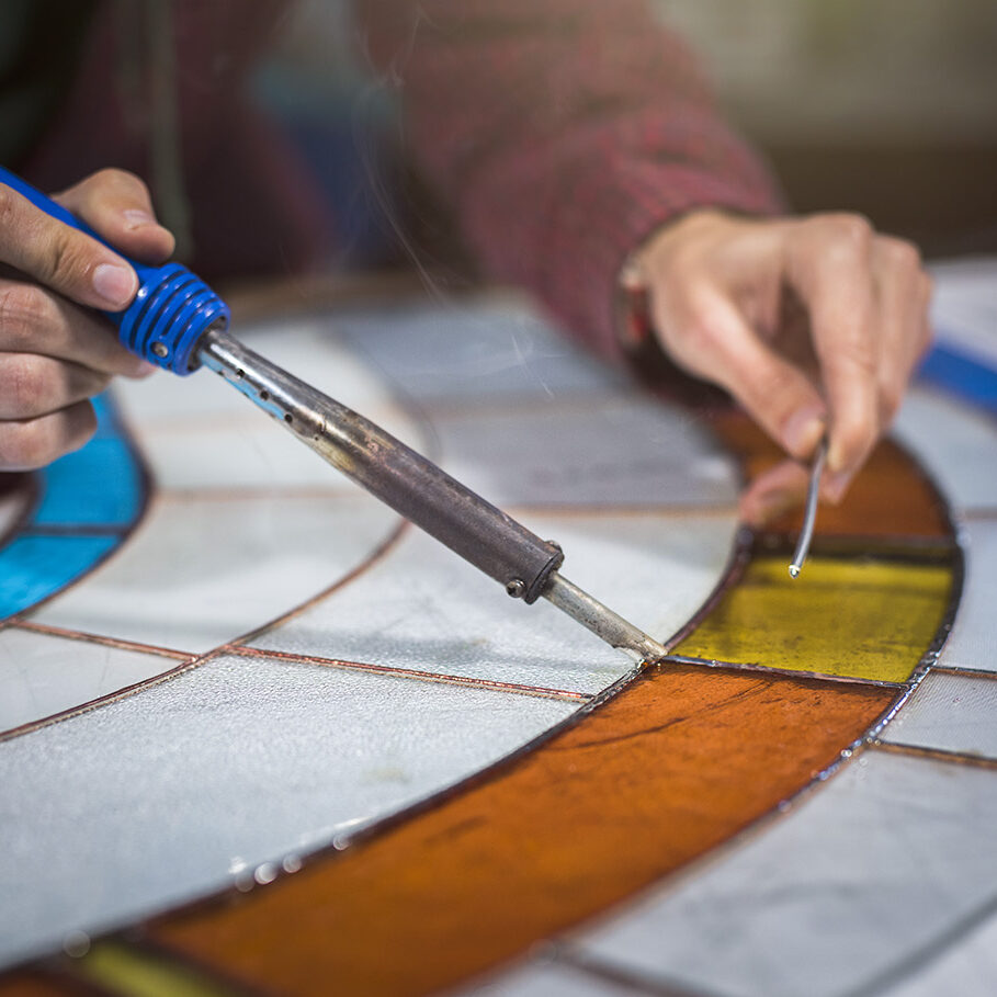 Student working on stained glass project.