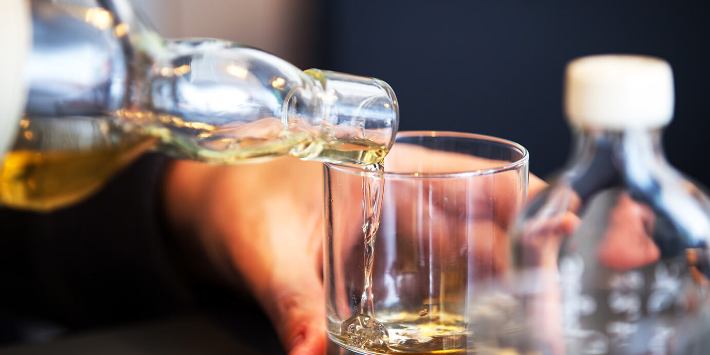 Pouring a glass of vintage whiskey Tasting a vintage whiskey