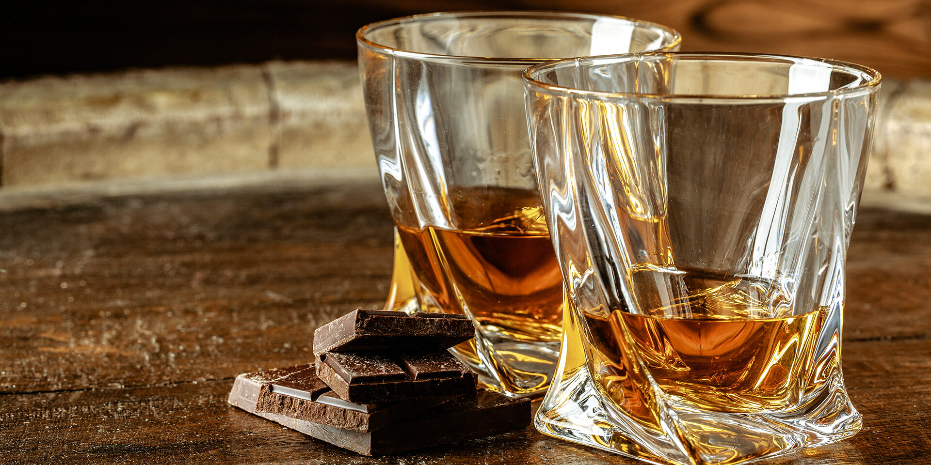 Two glasses of bourbon or scotch, or brandy and pieces of dark chocolate Two glasses of bourbon or scotch, or brandy and pieces of dark chocolate