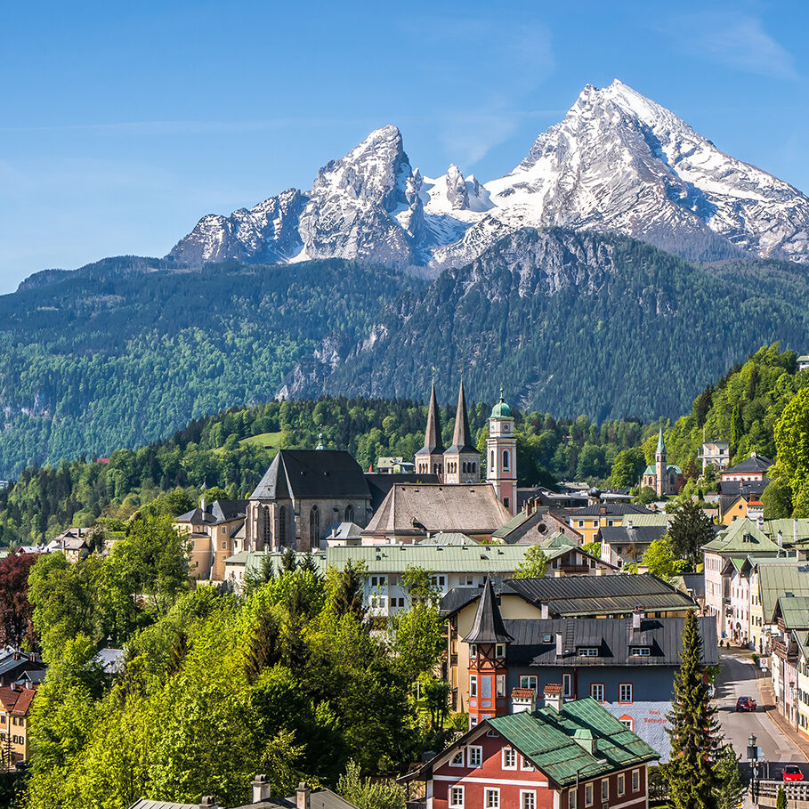 Historic town of Berchtesgaden with snowy Watzmann mountain in spring, Berchtesgadener Land, Upper Bavaria, Germany