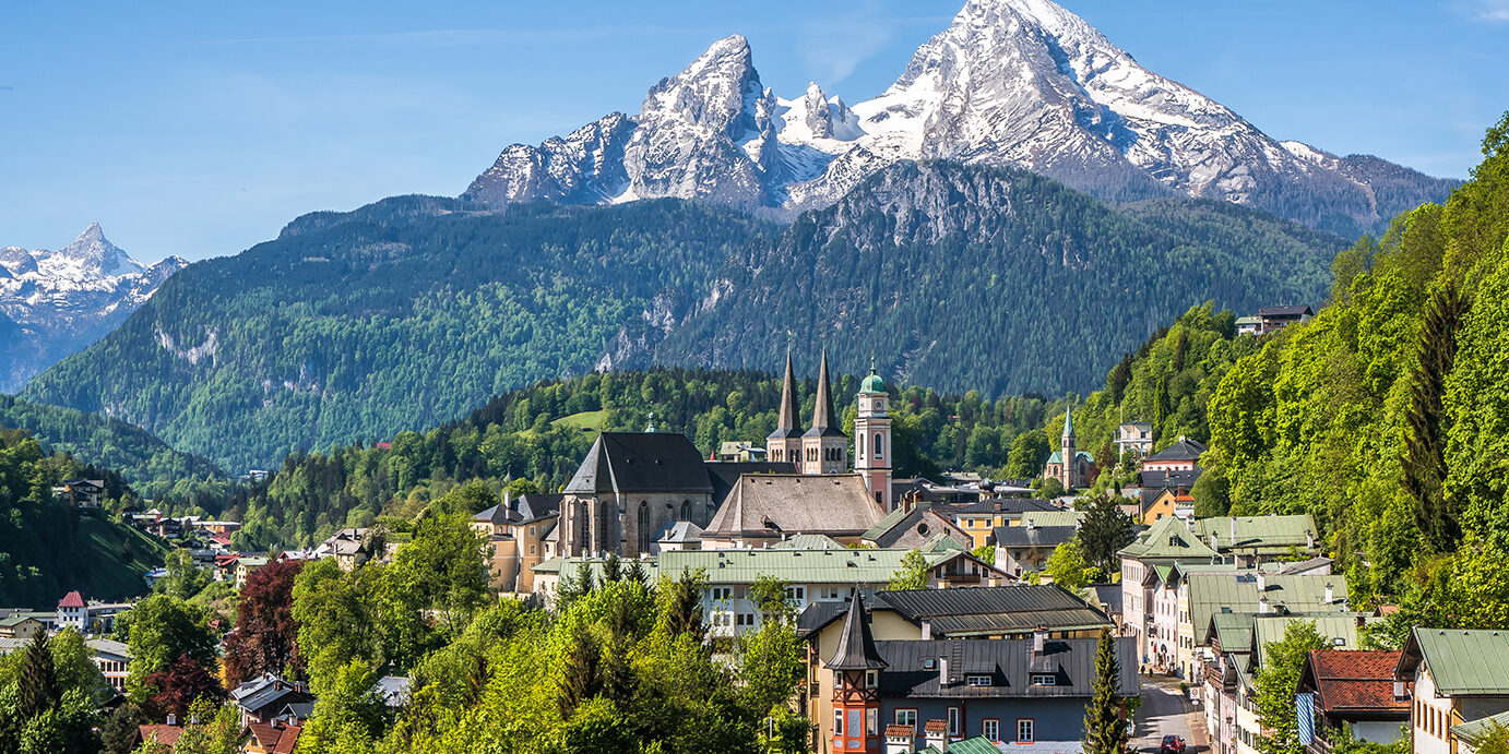 Historic town of Berchtesgaden with snowy Watzmann mountain in spring, Berchtesgadener Land, Upper Bavaria, Germany