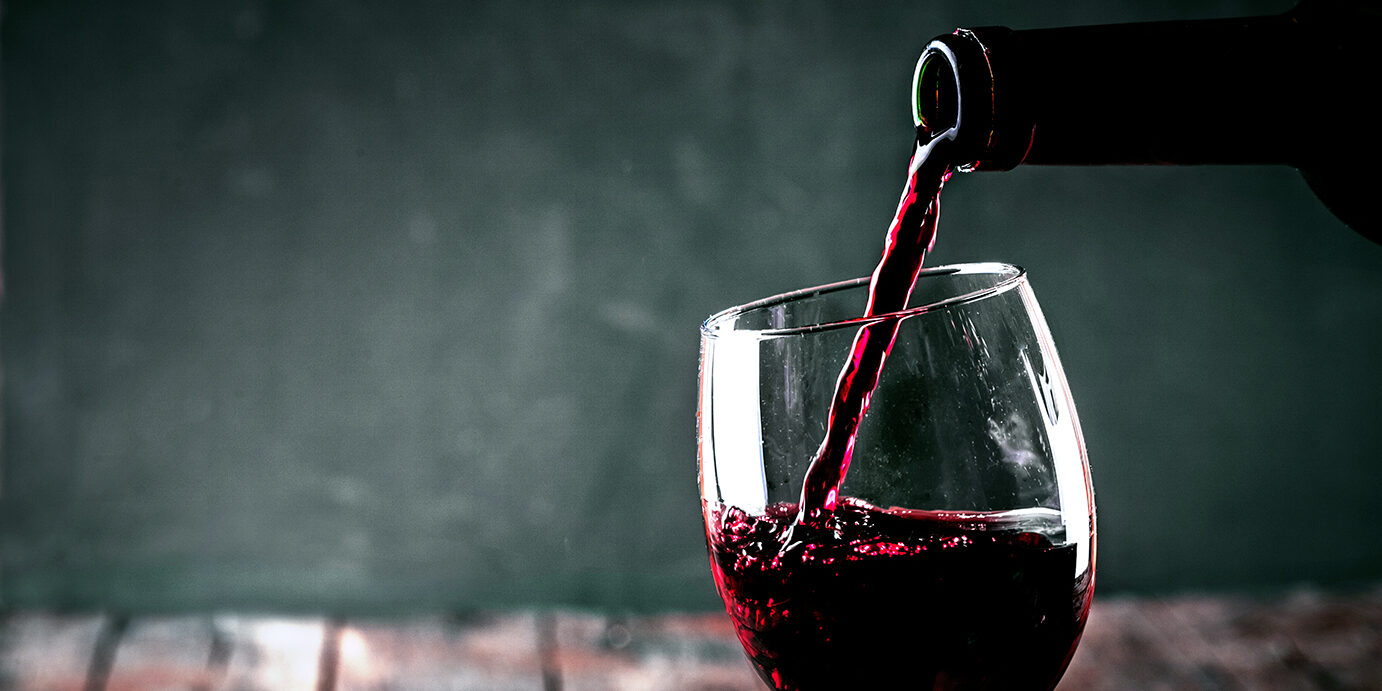 Red wine. Glass of wine. Pouring red wine.