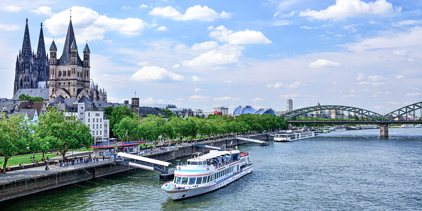 Promenade and Rhine River in Cologne, Germany. Composite photo