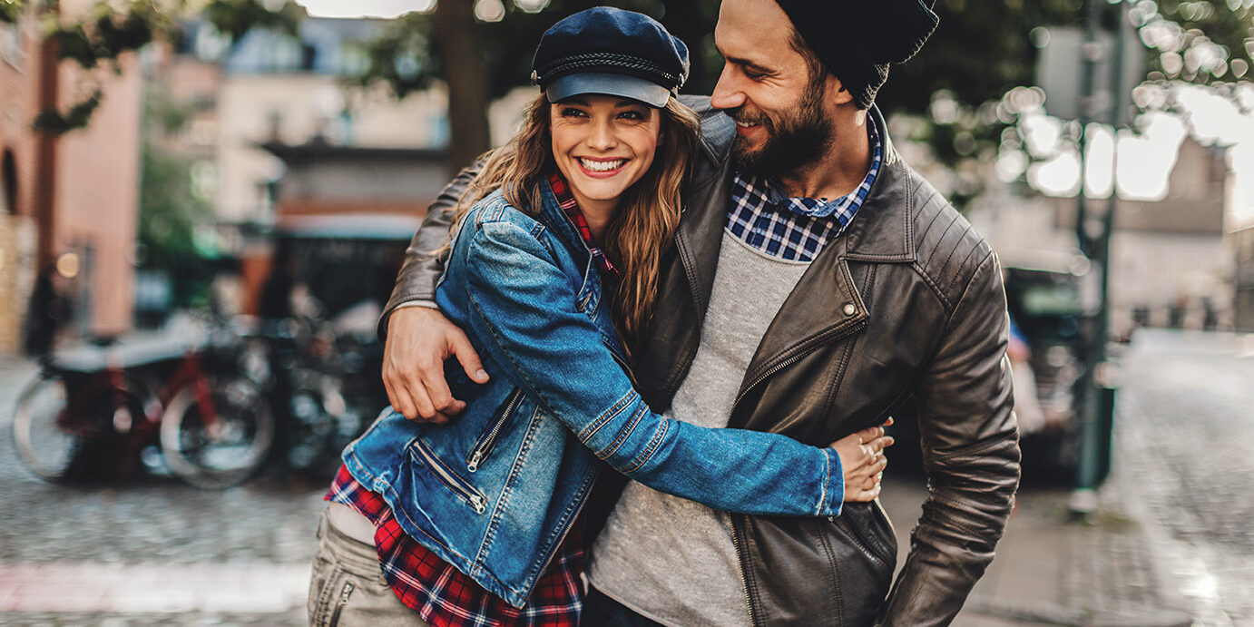 Close up of a happy young couple enjoying city life.