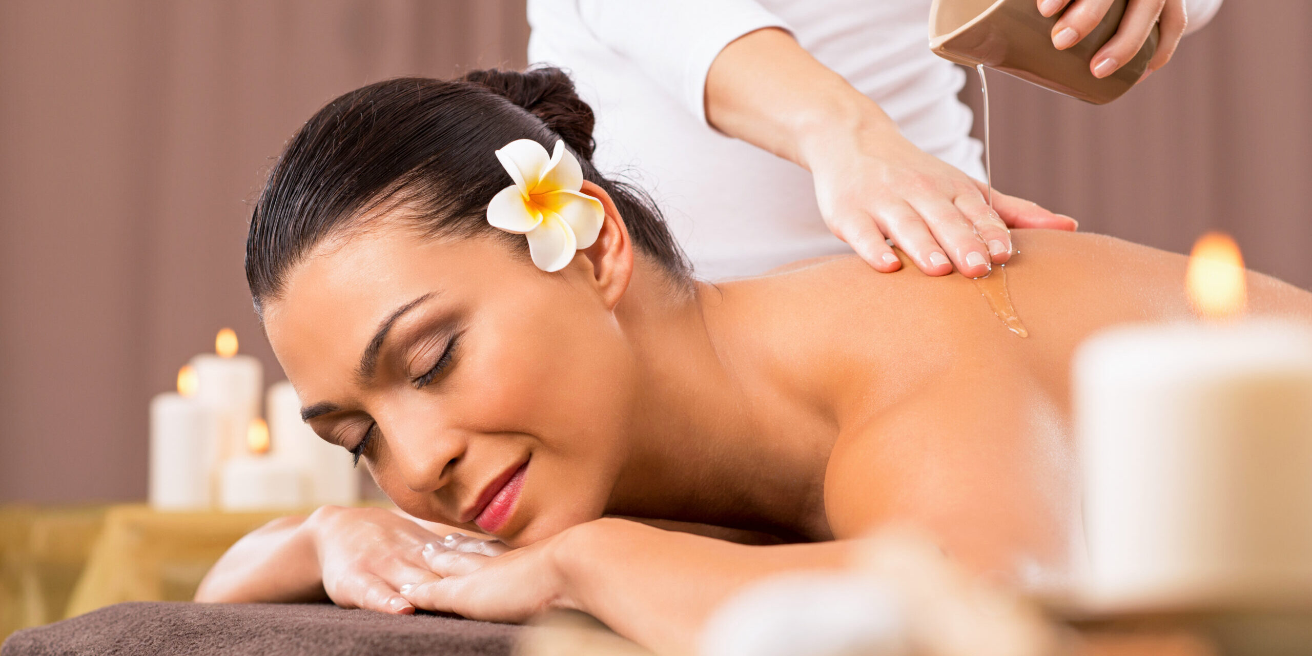 Relaxed Woman Receiving A Back Massage At Health Spa