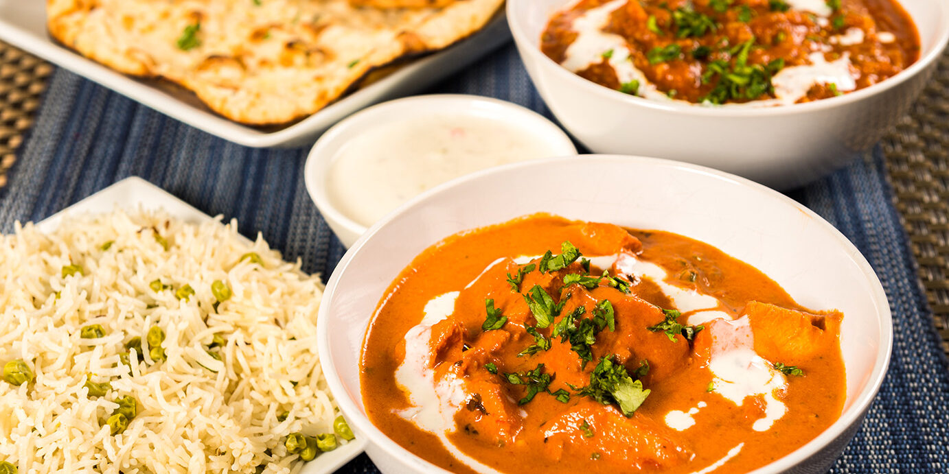 Authentic Indian Food Butter chicken curry, lamb vindaloo, basmati rice, nan bread and yoghurt raita