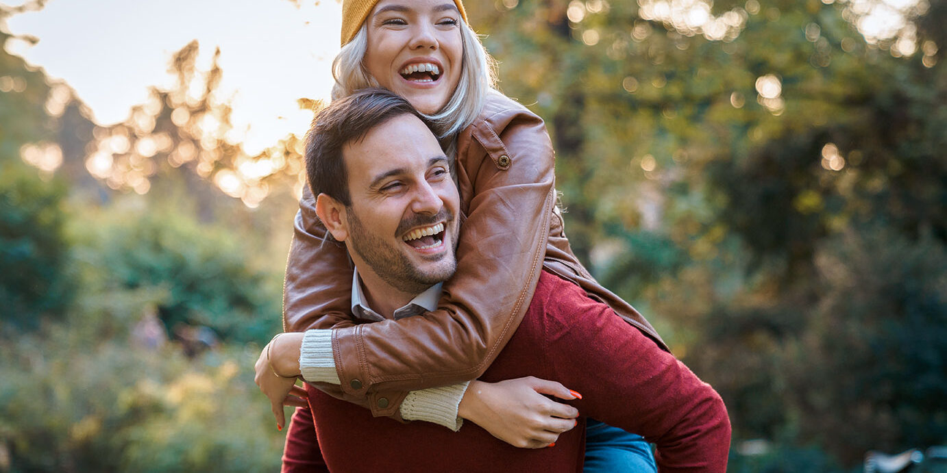 Young couple on romantic date having fun together outdoors - Stock Image