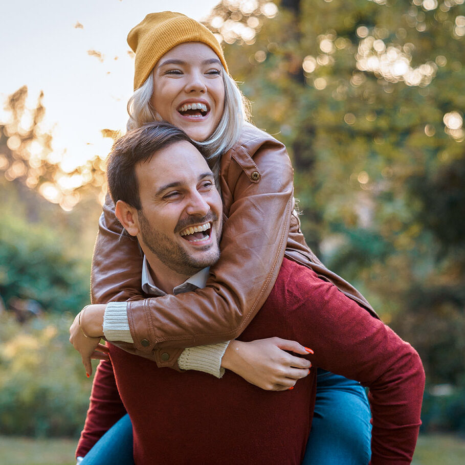 Young couple on romantic date having fun together outdoors - Stock Image