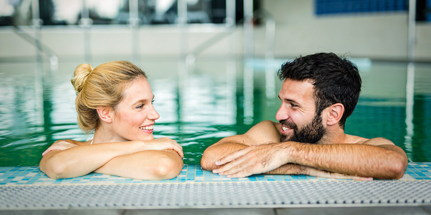 Picture of happy couple relaxing in spa pool