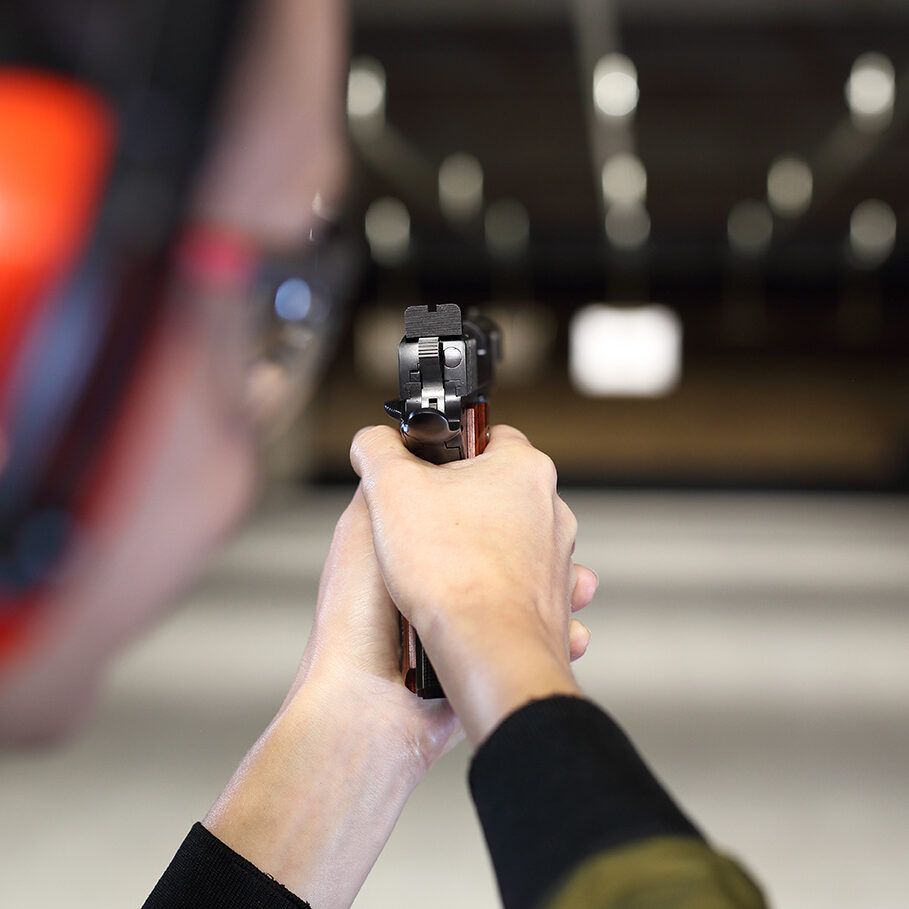 Measuring to a paper target on the shooting range.