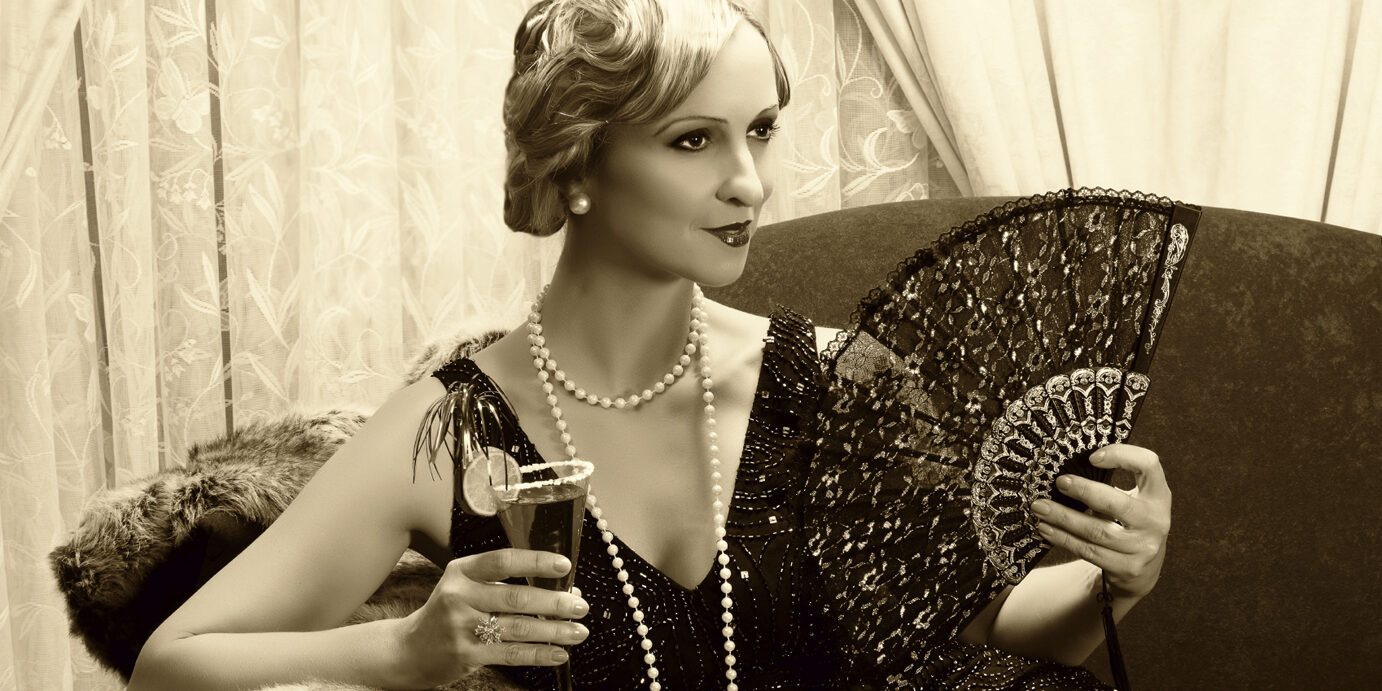 Sepia twenties cocktail Sepia image of a vintage twenties lady with cocktail and lace fan