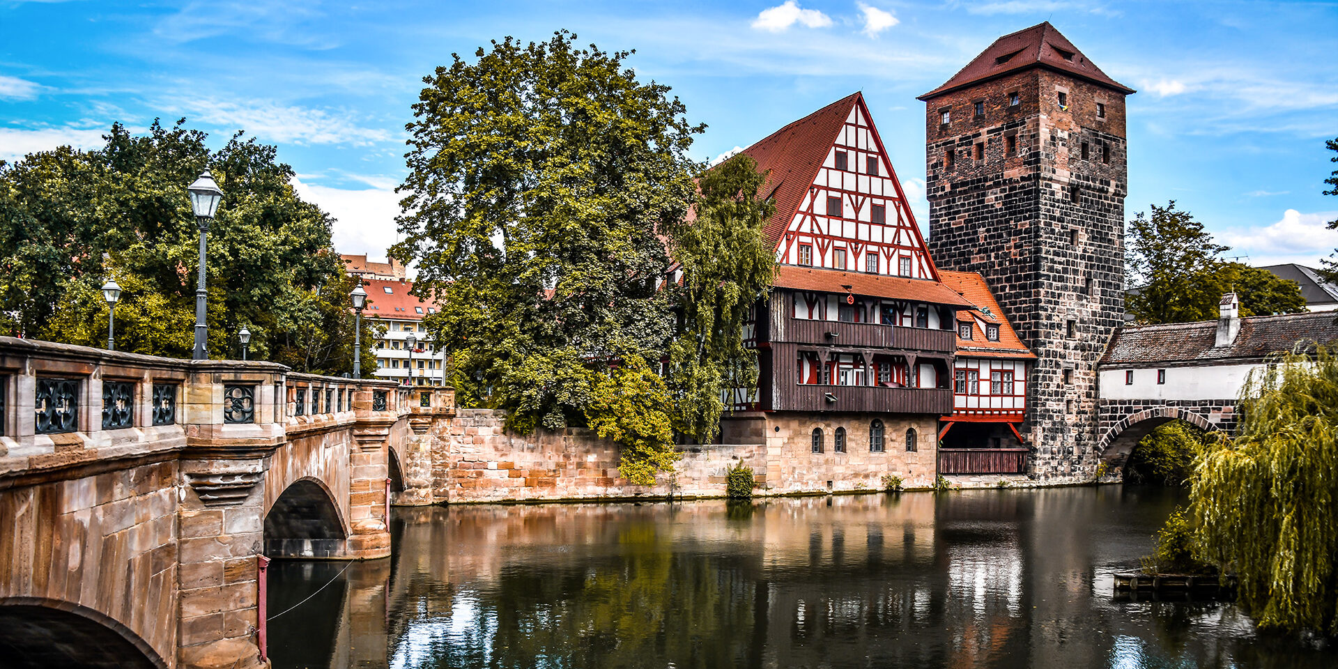 Scenic View Of Old Town And Hangman's Bridge Over Pegnitz River In Nuremberg, Germany Scenic View Of Old Town And Hangman's Bridge Over Pegnitz River In Nuremberg, Germany