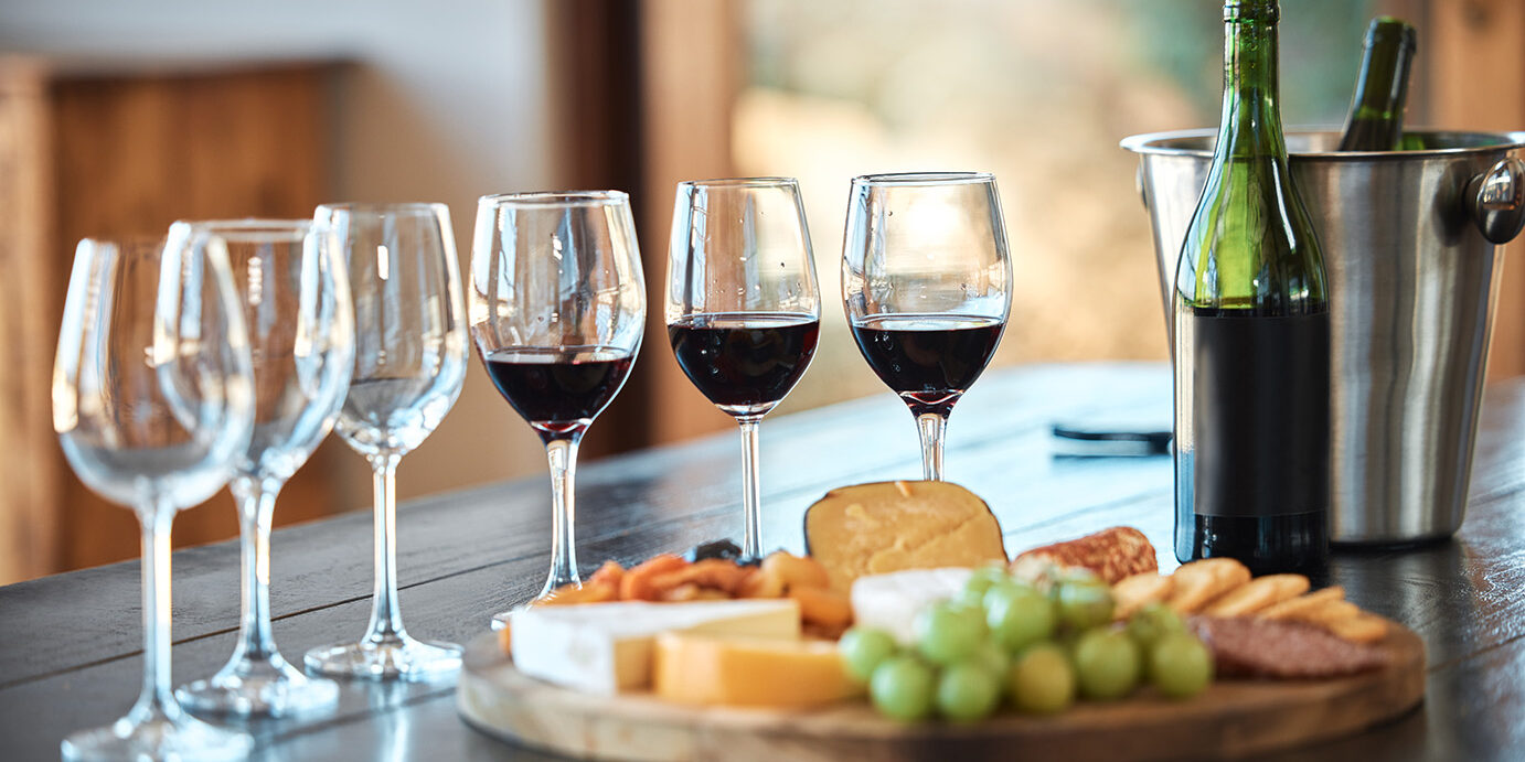 A row of glasses and a cheese board set up for a wine tasting inside a restaurant. A cheese platter the right wine is the perfect pairing for a relaxing and carefree day out, to get away from it all A row of glasses and a cheese board set up for a wine tasting inside a restaurant. A cheese platter the right wine is the perfect pairing for a relaxing and carefree day out, to get away from it all
