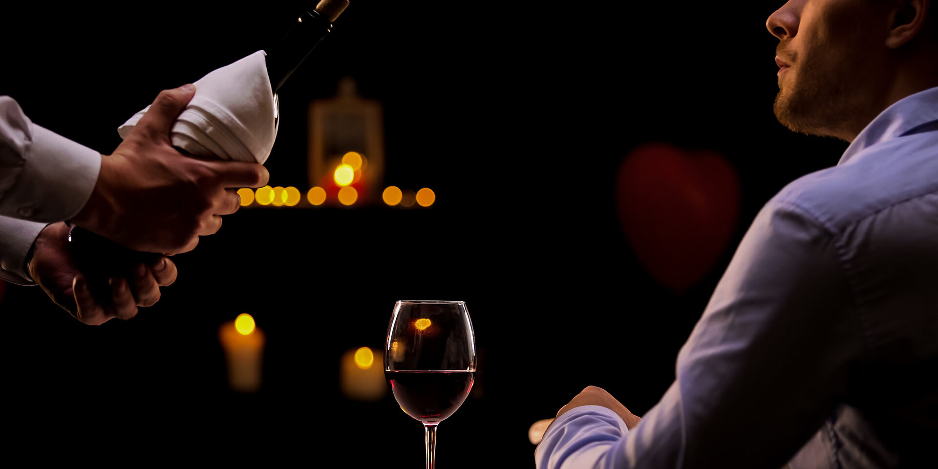 Waiter bringing handsome male customer high-quality red wine, gourmet dinner Waiter bringing handsome male customer high-quality red wine, gourmet dinner
