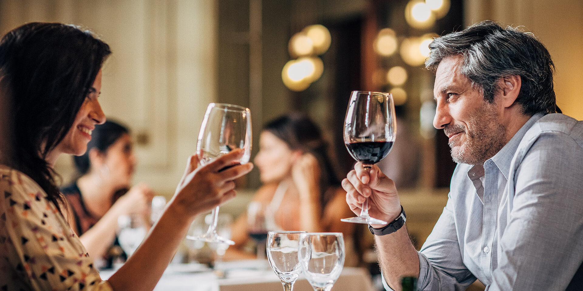 Mature couple on a date Mature heterosexual couple having a date in restaurant