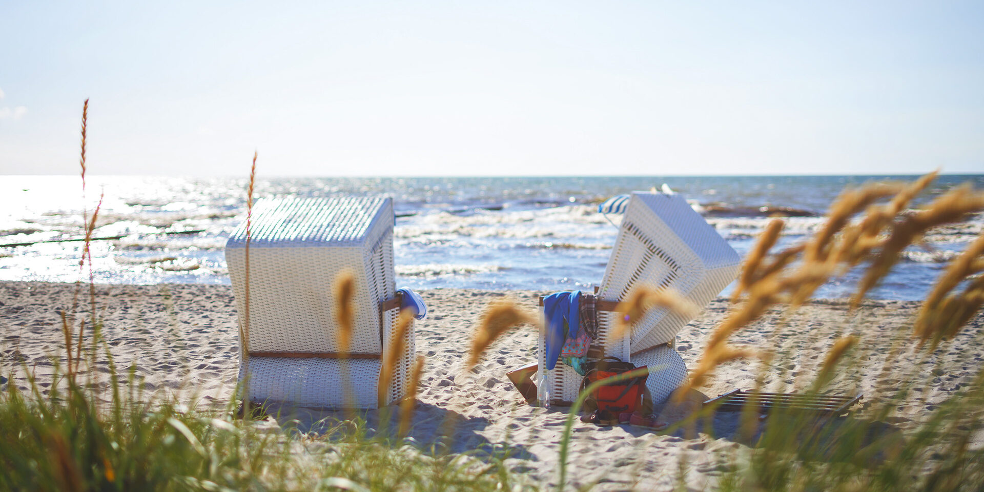 Public Hooded Beach Chairs by the water.