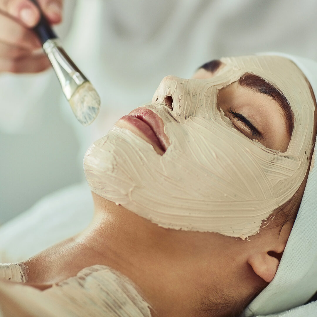 Shot of an attractive young woman getting a facial at a beauty spa