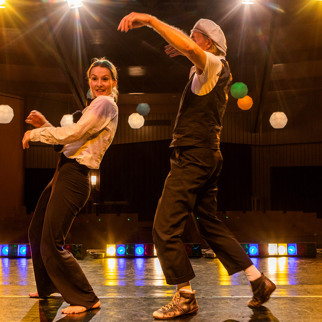 Two actors performing on stage