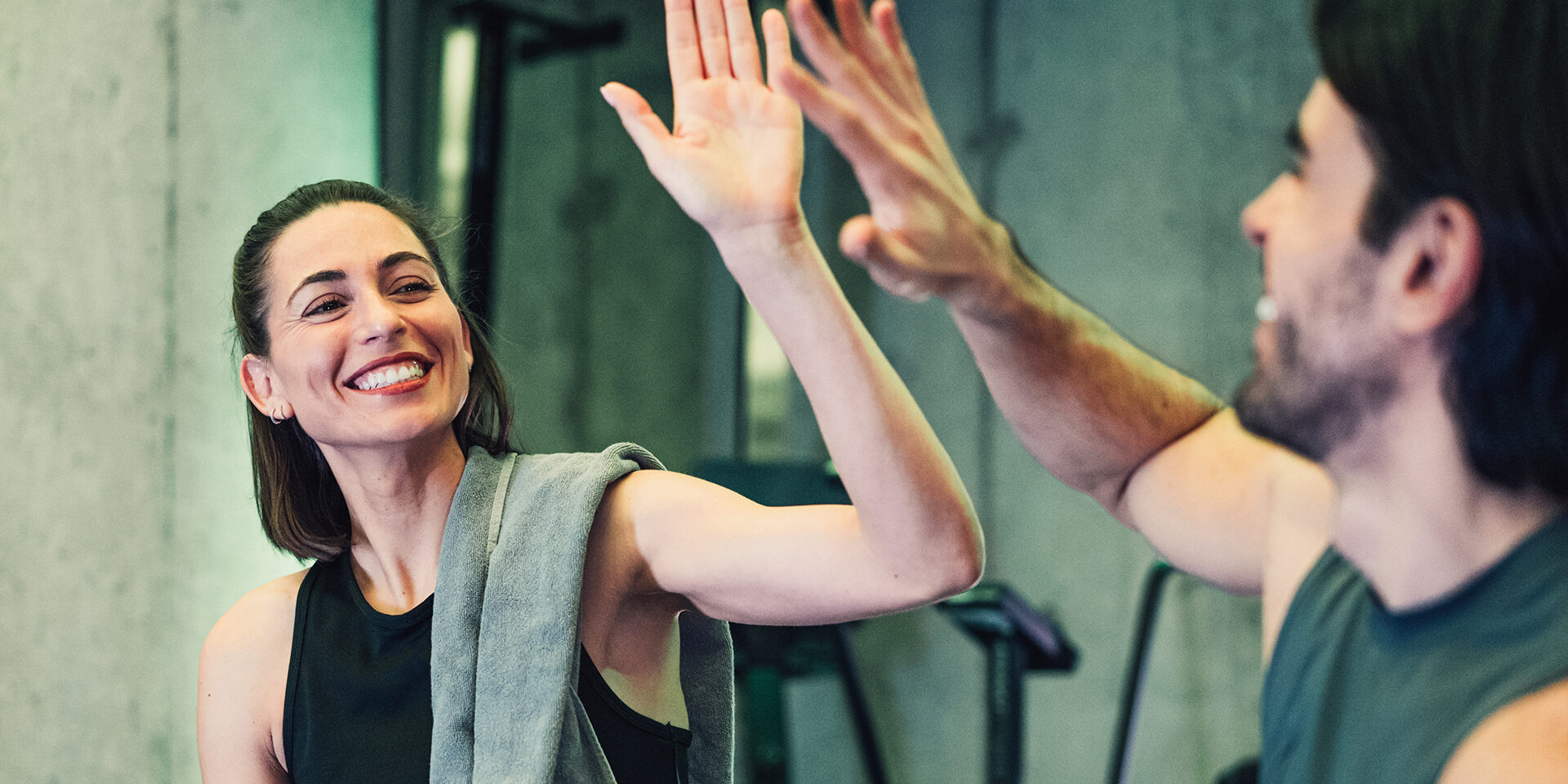 Shot of an young couple exercising together in the gym.