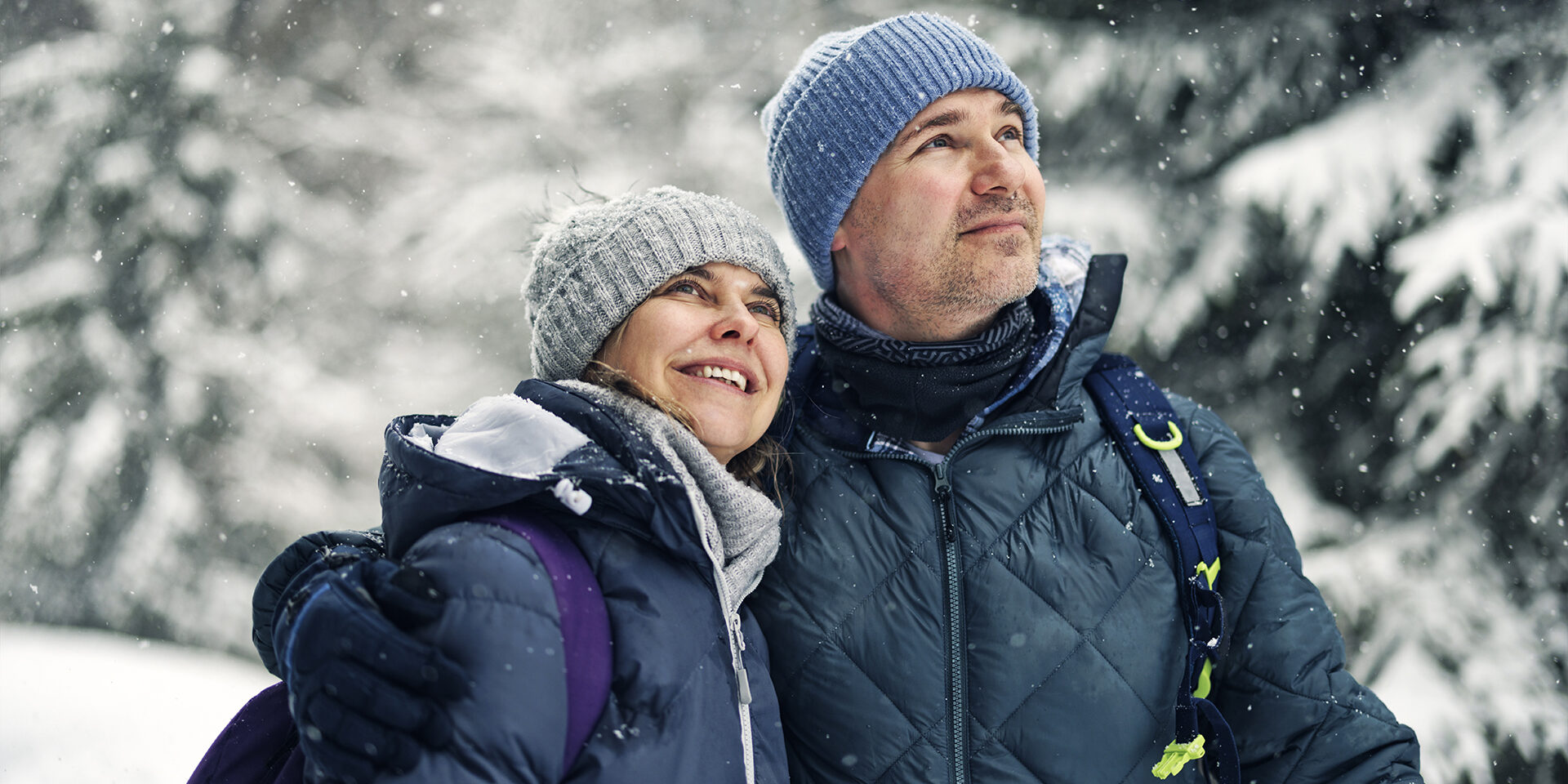 Portrait of middle aged couple hiking in beautiful European Alps mountains on an overcast  winter day
Shot with Canon R5