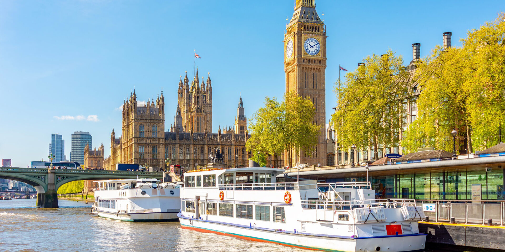 Westminster pier and Houses of Parliament with Big Ben, London, UK