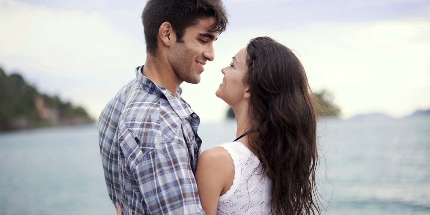 Shot of an affectionate young couple enjoying a vacation by the sea