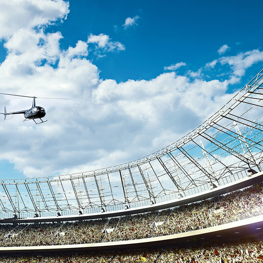 crowded soccer stadium on blue cloudy sky background